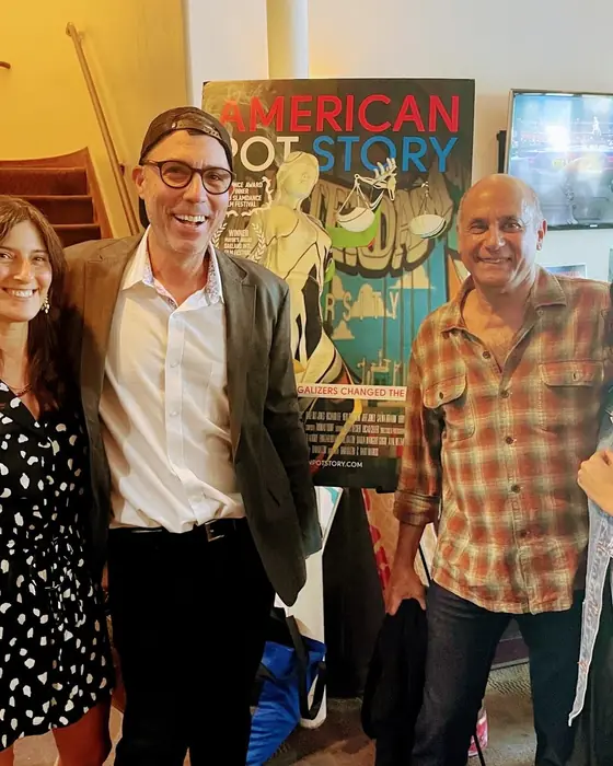 A director with guests in the cinema lobby